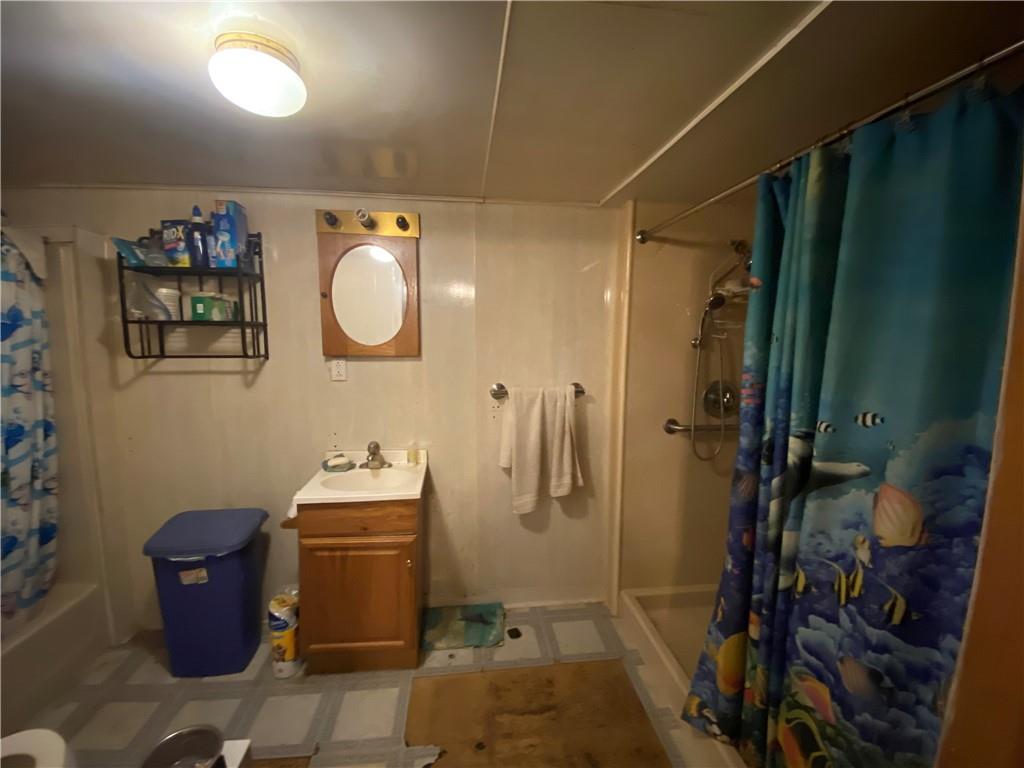 290 Calverts Hill Road Spraggs, PA 15362 - Photo 18 of 22 a bathroom with a sink toilet and shower