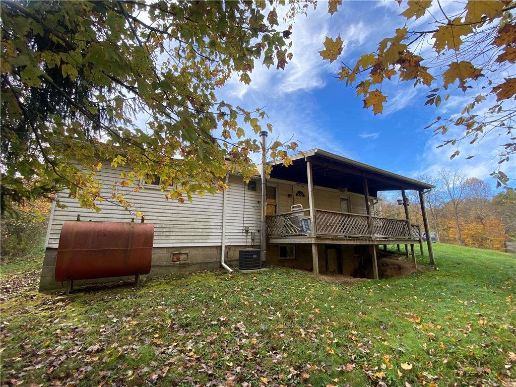 290 Calverts Hill Road Spraggs, PA 15362 - Photo 21 of 22 a front view of a house with a yard