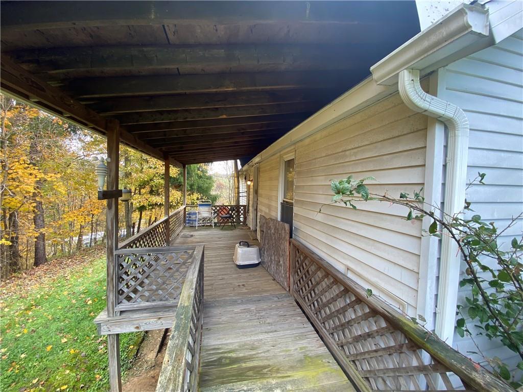 290 Calverts Hill Road Spraggs, PA 15362 - Photo 4 of 22 a view of a porch with furniture