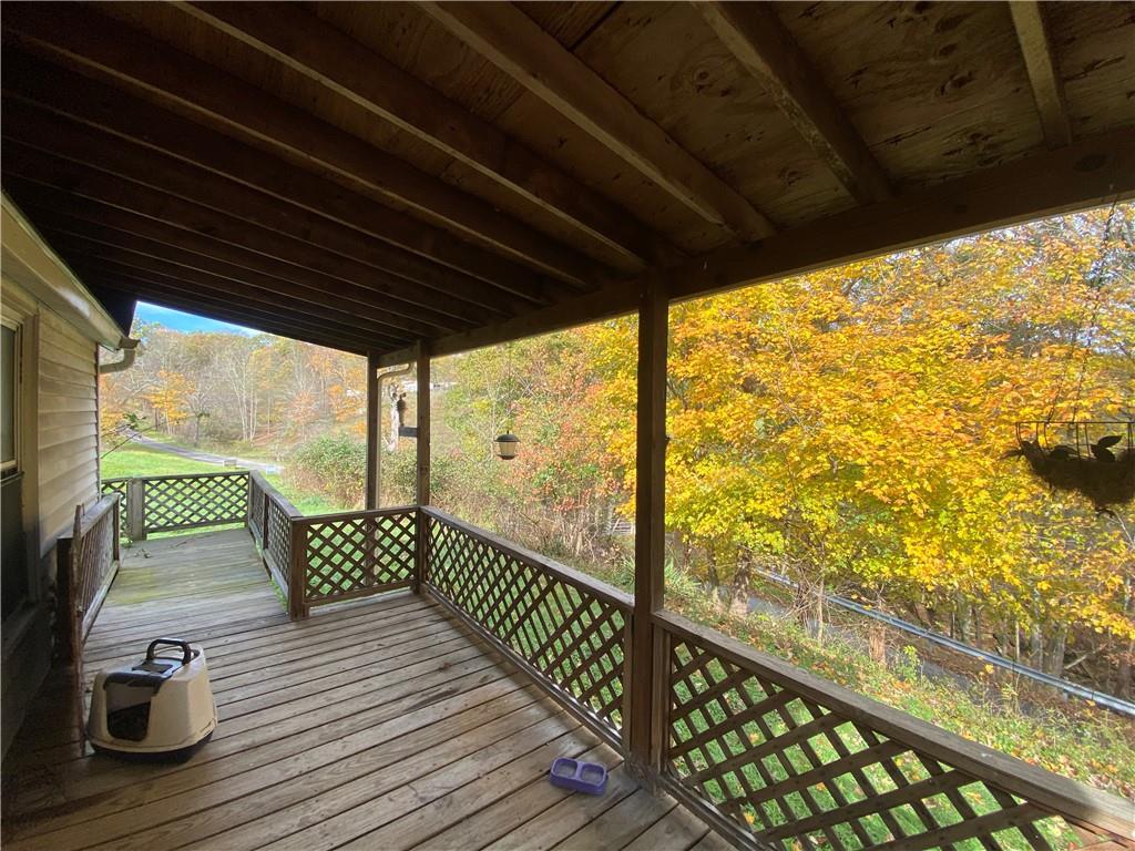 290 Calverts Hill Road Spraggs, PA 15362 - Photo 5 of 22 a view of balcony with wooden floor