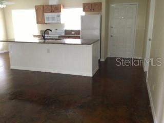 344 Beverly Road Venice, FL 34293 - Photo 4 of 14 a kitchen with a sink and cabinets