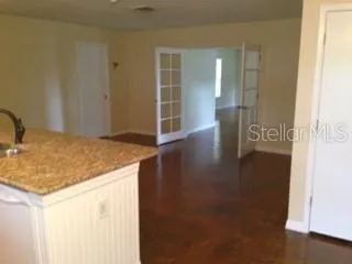 a view of a kitchen cabinets and wooden floor
