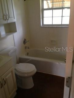 344 Beverly Road Venice, FL 34293 - Photo 9 of 14 a white toilet sitting next to a bathroom sink