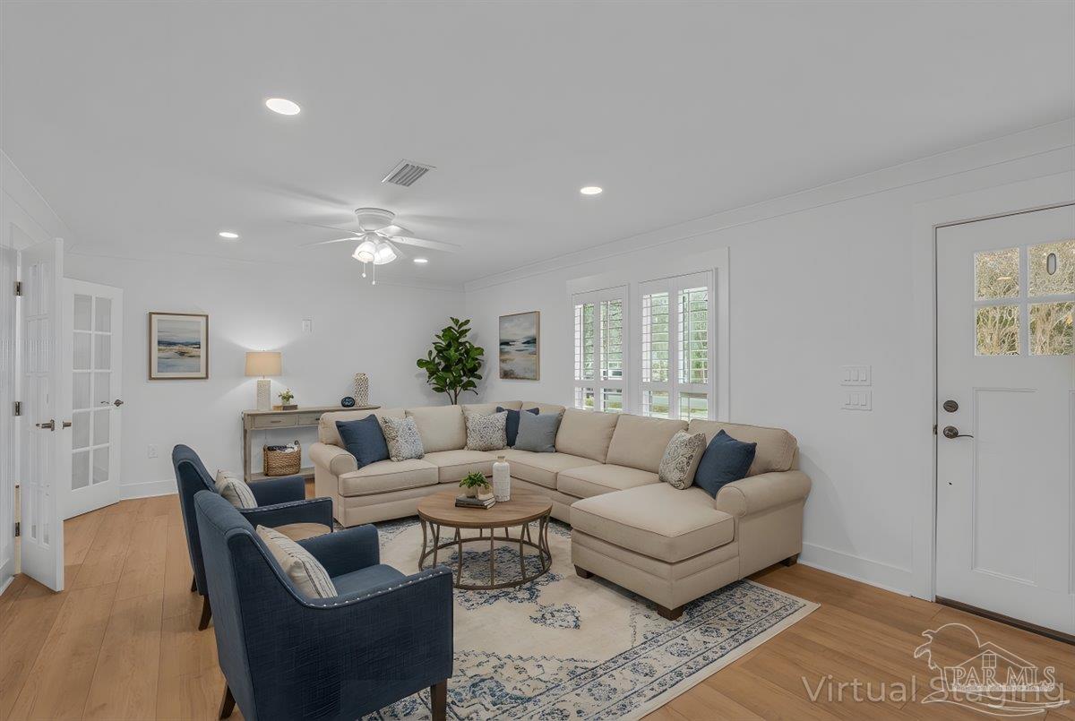3540 Dunfries Road Pensacola, FL 32503 - Photo 12 of 48 a living room with furniture and wooden floor