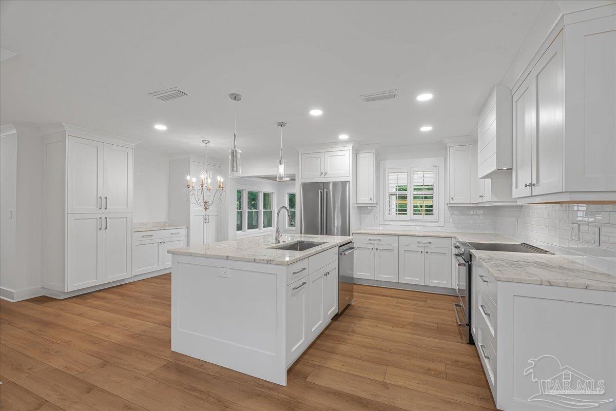 3540 Dunfries Road Pensacola, FL 32503 - Photo 17 of 48 a kitchen with a sink and cabinets