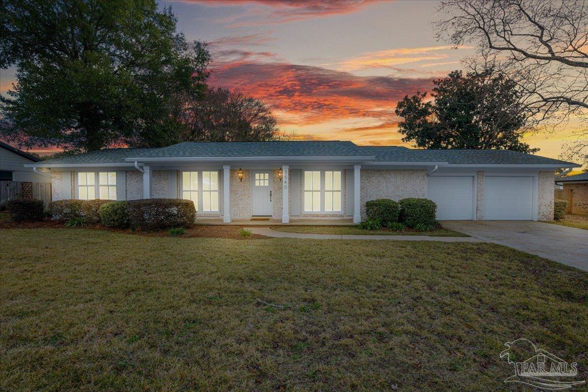 3540 Dunfries Road Pensacola, FL 32503 - Photo 2 of 48 a front view of house with yard and green space
