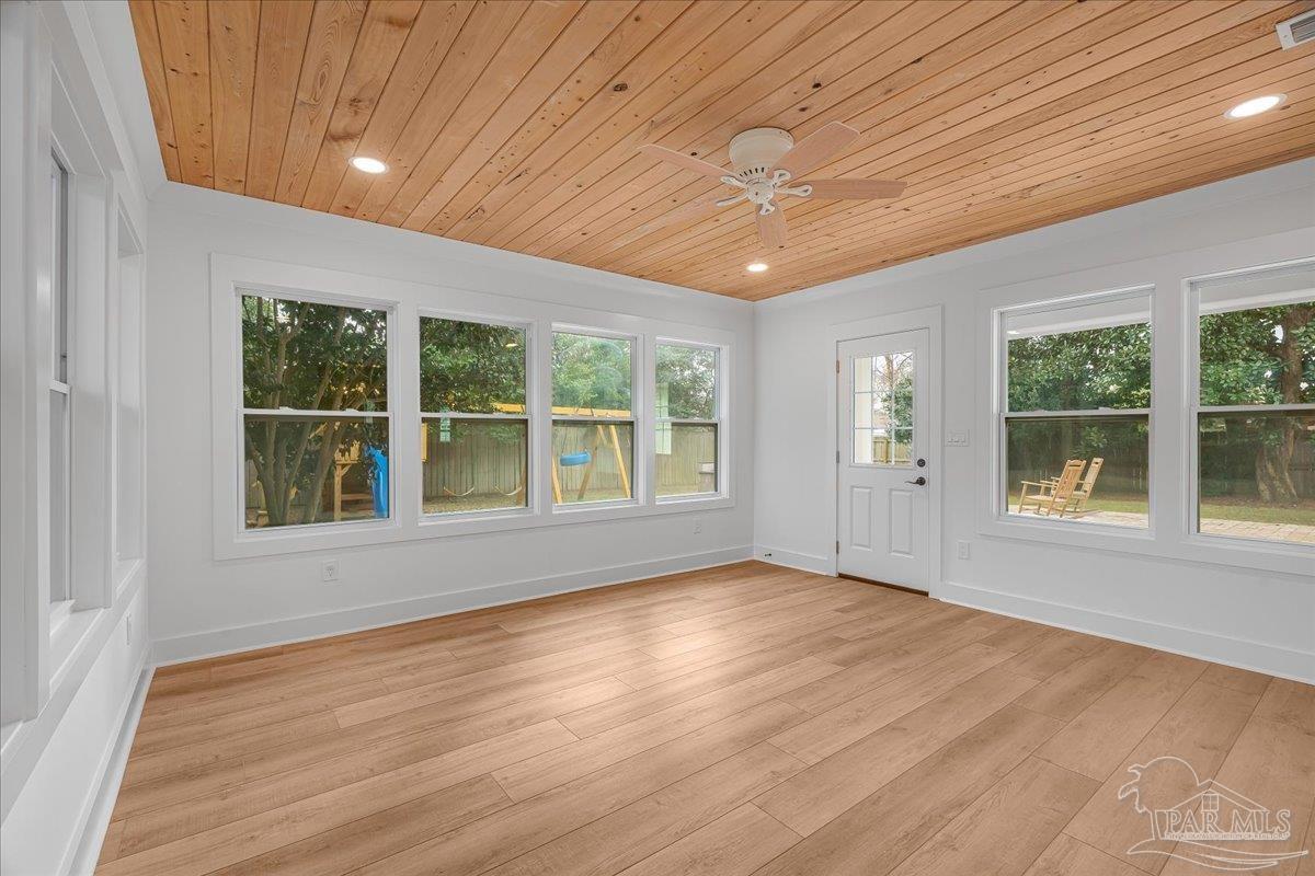 3540 Dunfries Road Pensacola, FL 32503 - Photo 21 of 48 an empty room with wooden floor and windows