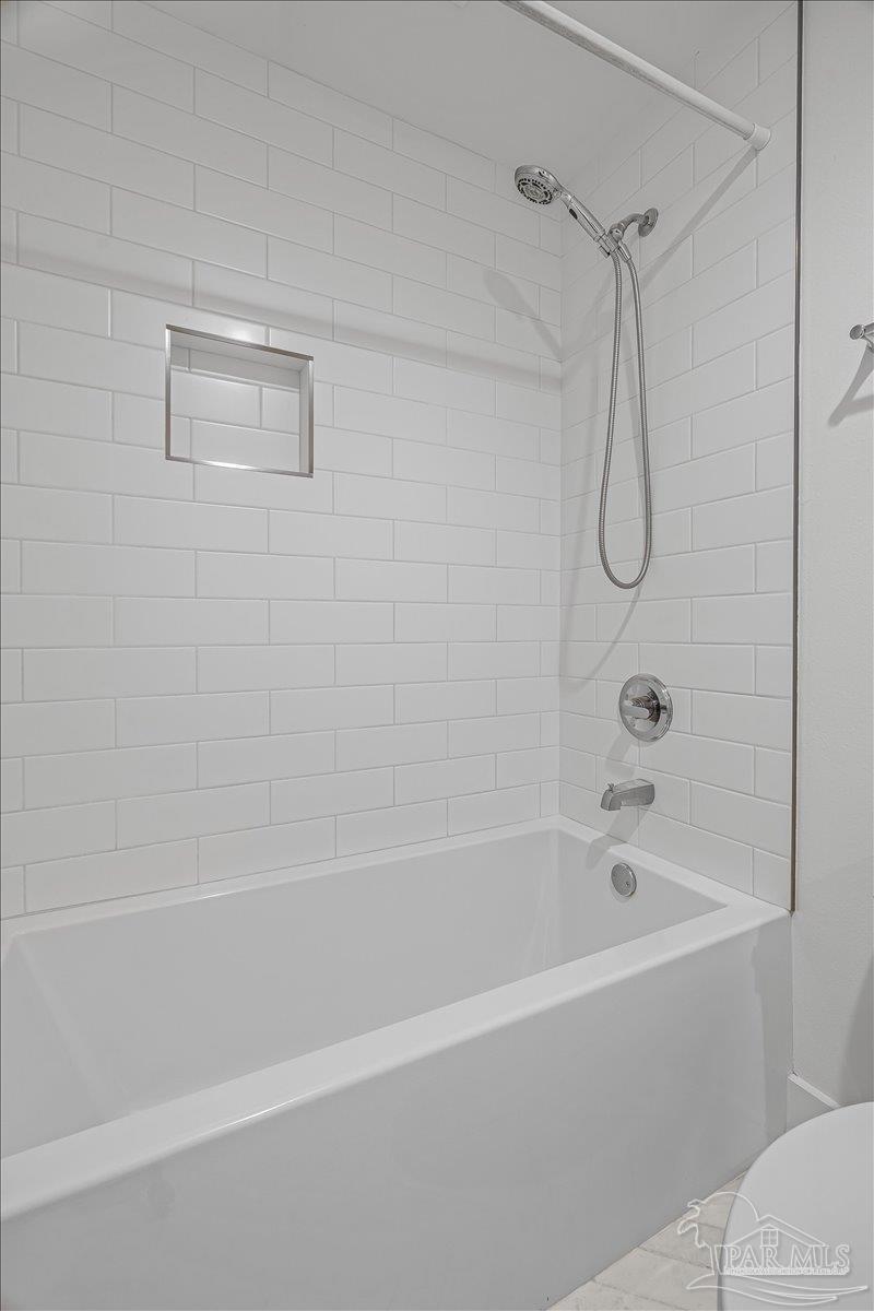3540 Dunfries Road Pensacola, FL 32503 - Photo 29 of 48 a bathroom with a bath tub with a shower