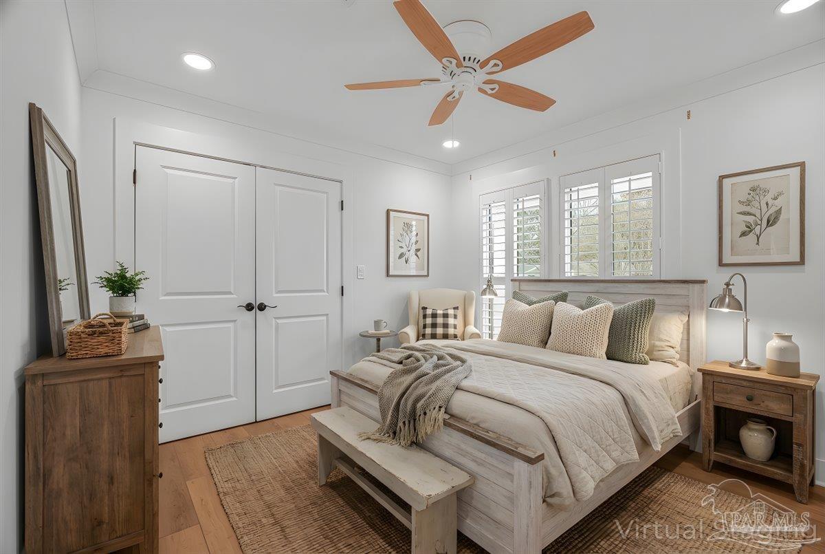 3540 Dunfries Road Pensacola, FL 32503 - Photo 31 of 48 a bedroom with a bed and a chandelier