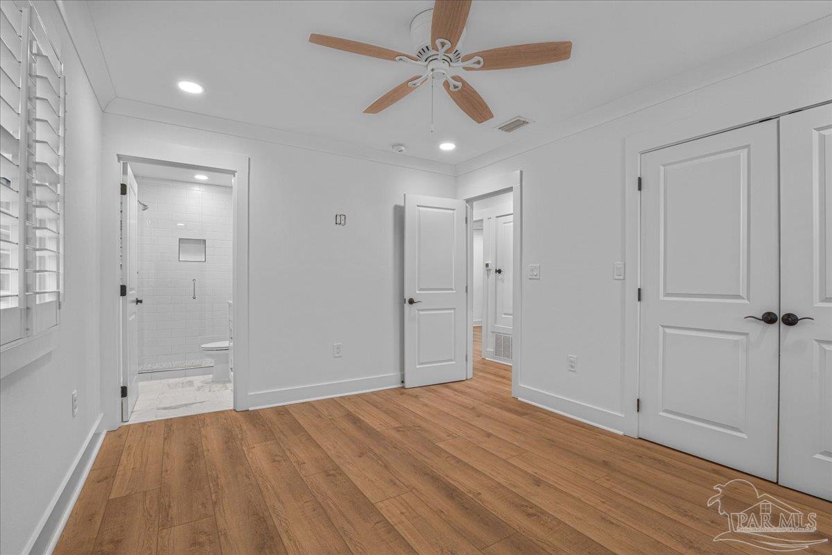 3540 Dunfries Road Pensacola, FL 32503 - Photo 36 of 48 wooden floor in an empty room with a window