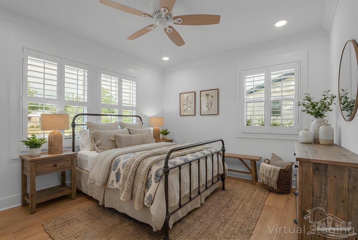 3540 Dunfries Road Pensacola, FL 32503 - Photo 39 of 48 a bedroom with a bed and a chandelier