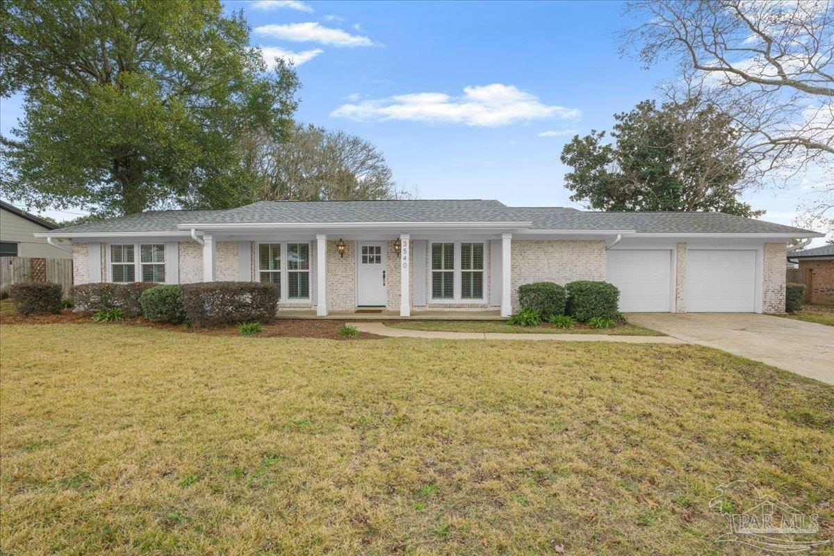 3540 Dunfries Road Pensacola, FL 32503 - Photo 4 of 48 a front view of a house with a yard