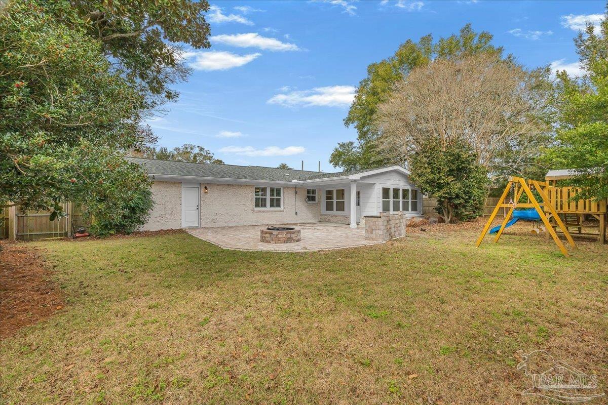 3540 Dunfries Road Pensacola, FL 32503 - Photo 44 of 48 a view of a house with a backyard and a tree
