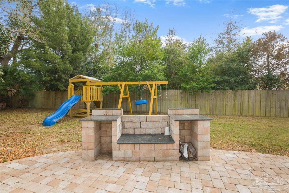3540 Dunfries Road Pensacola, FL 32503 - Photo 45 of 48 a view of a house with pool and chairs