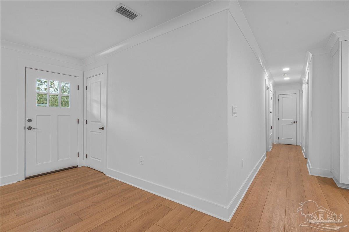 3540 Dunfries Road Pensacola, FL 32503 - Photo 6 of 48 a view of empty room with wooden floor