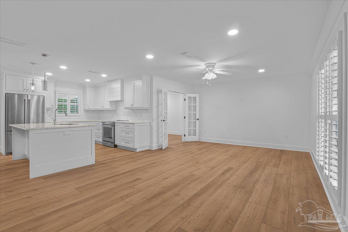 3540 Dunfries Road Pensacola, FL 32503 - Photo 7 of 48 a view of kitchen with wooden floor