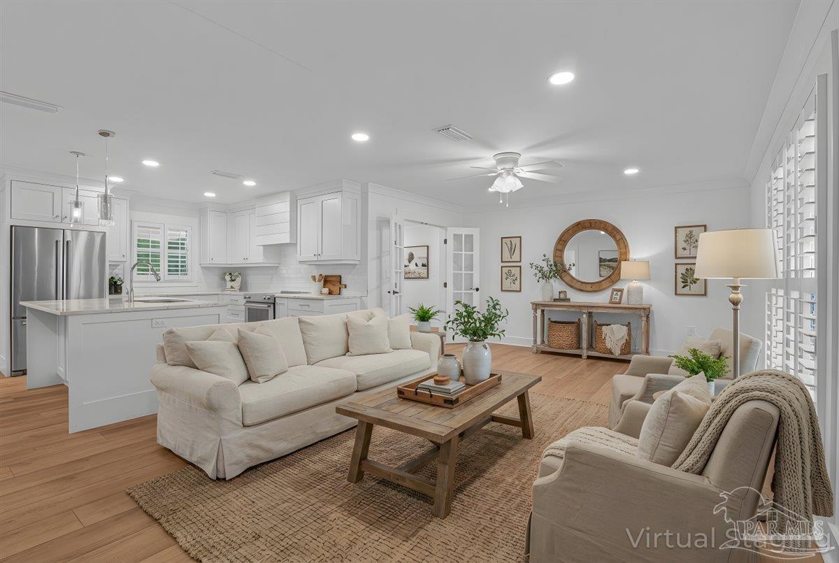 3540 Dunfries Road Pensacola, FL 32503 - Photo 9 of 48 a living room with furniture kitchen view and a wooden floor