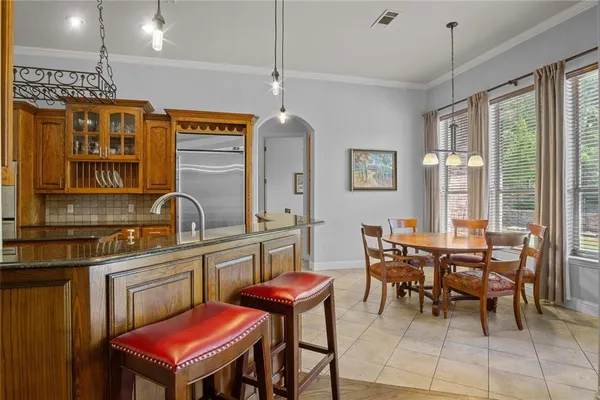 a dining room with furniture and window