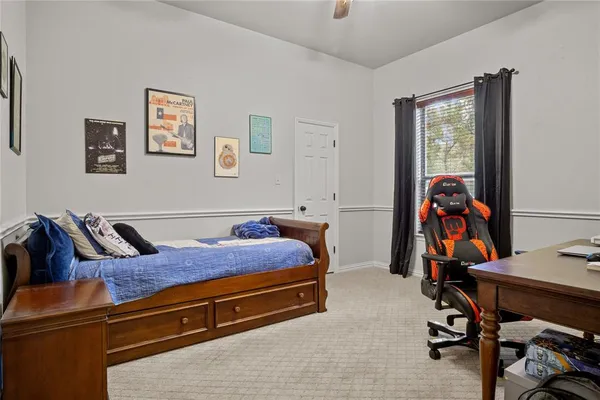 a bed room with a bed and window
