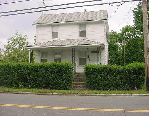 426 Reef Road Fairfield, CT 06824 - Photo 1 of 1 a front view of a house with a garden