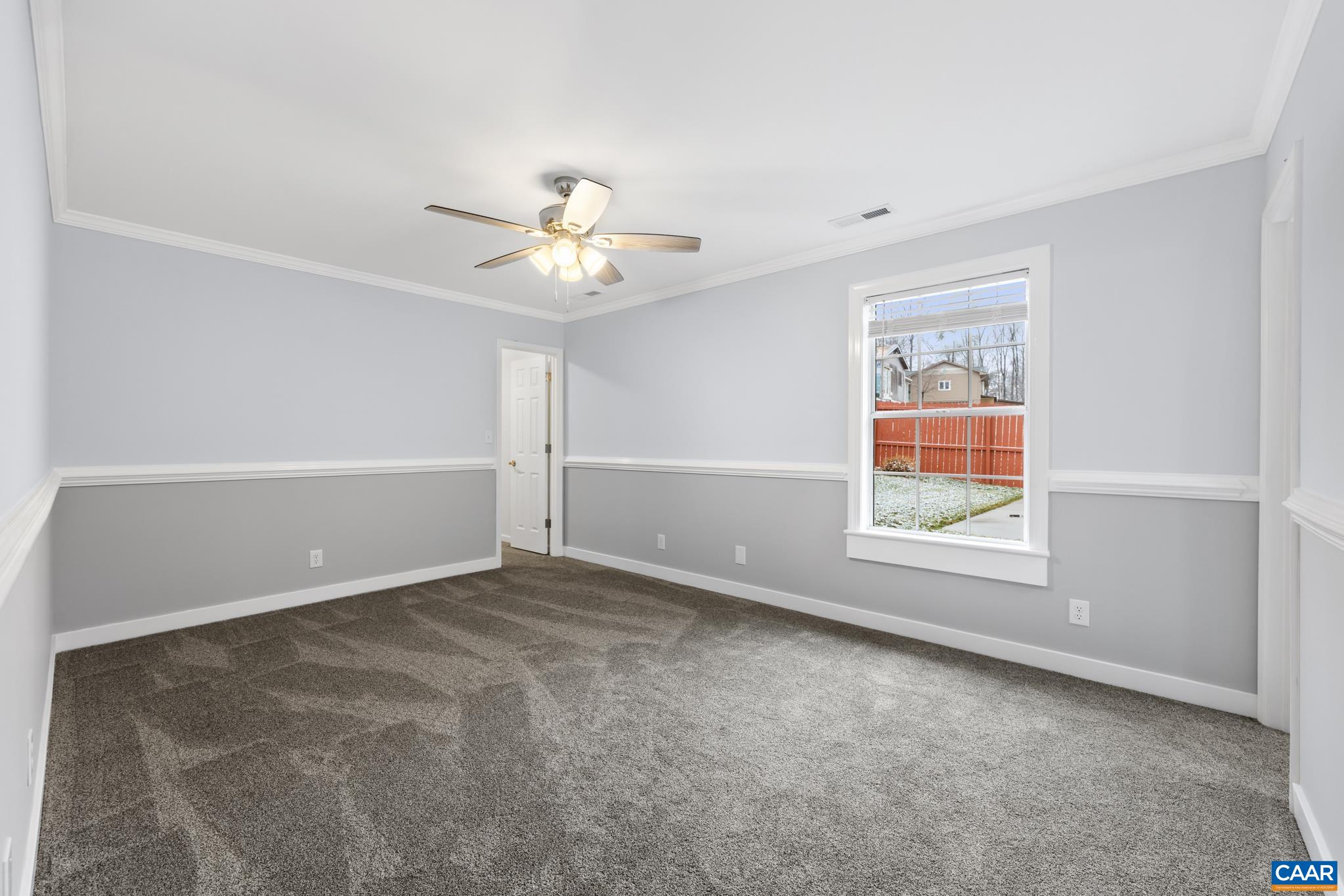23 North Ridge Way Stanardsville, VA 22973 - Photo 15 of 19 an empty room with windows and chandelier fan