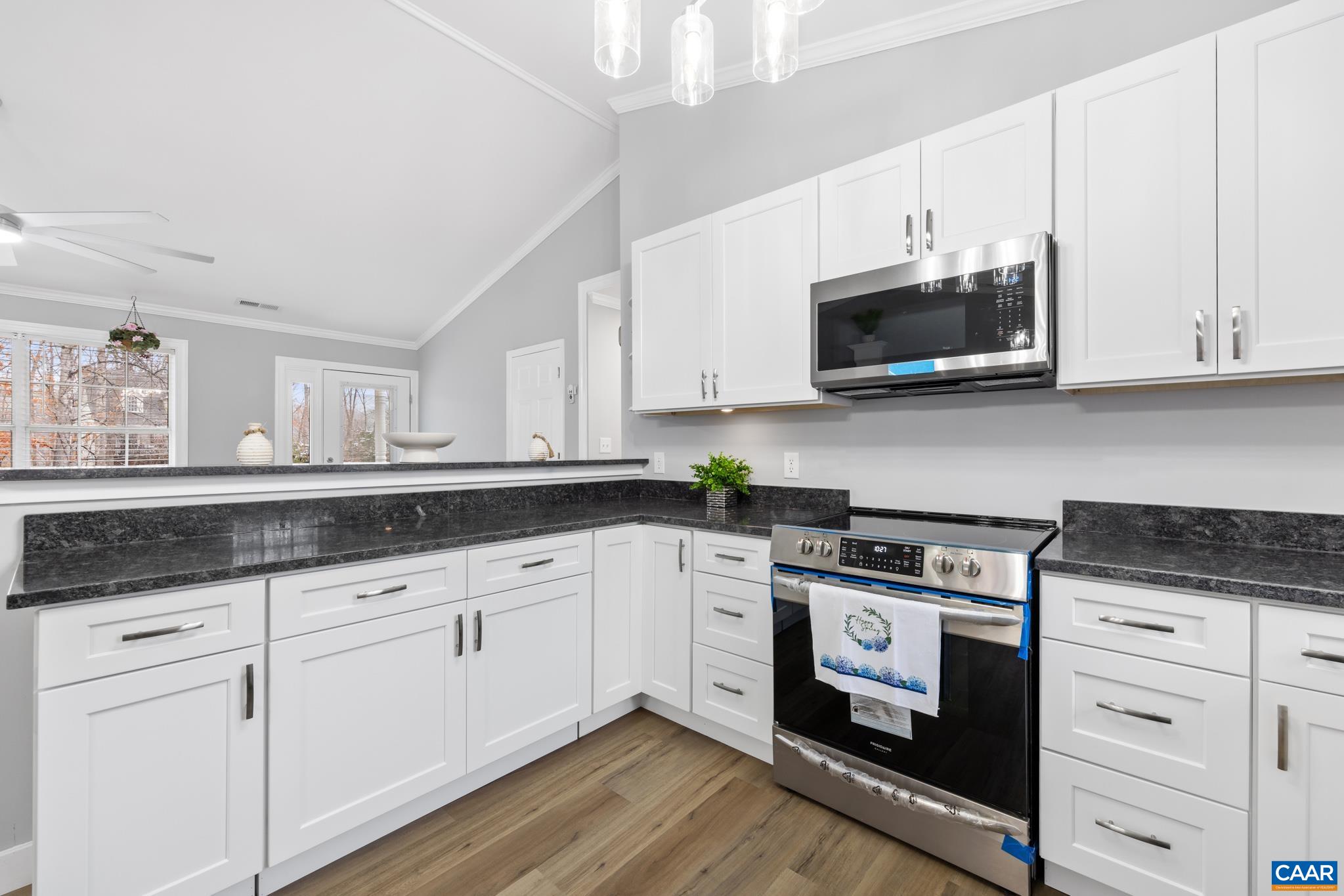 23 North Ridge Way Stanardsville, VA 22973 - Photo 8 of 19 a kitchen with granite countertop white cabinets white stainless steel appliances and a sink