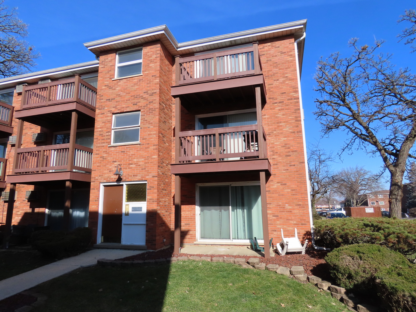 14830 Ketelaar Drive, Unit 4E Midlothian, IL 60445 - Photo 1 of 23 front view of a house with a yard