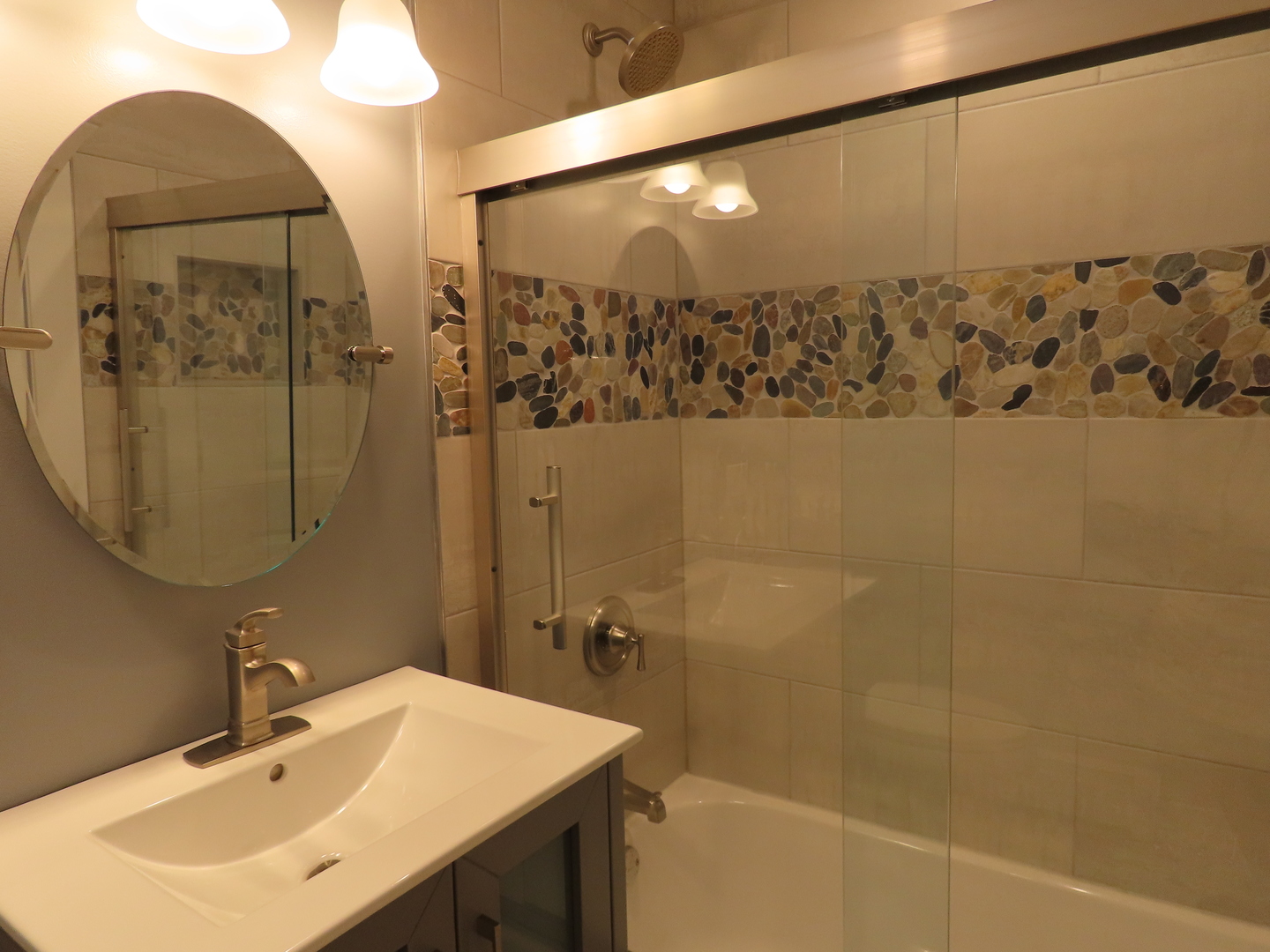 14830 Ketelaar Drive, Unit 4E Midlothian, IL 60445 - Photo 16 of 23 a bathroom with a sink mirror and shower