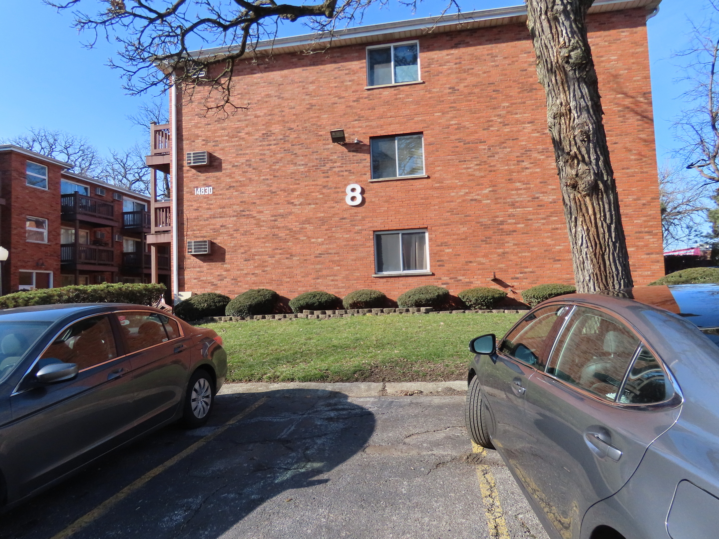14830 Ketelaar Drive, Unit 4E Midlothian, IL 60445 - Photo 22 of 23 a view of a car parked front of a house