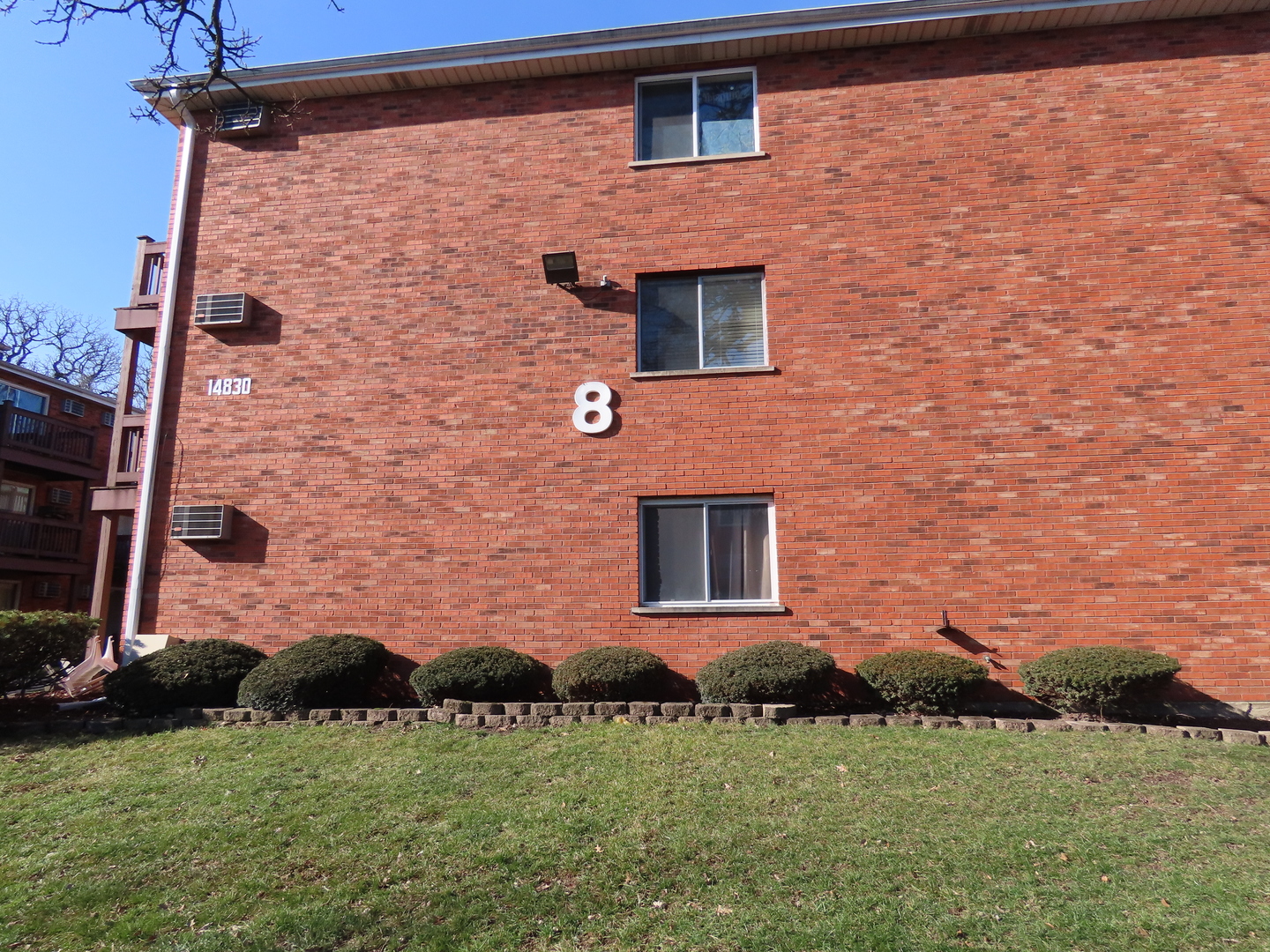 14830 Ketelaar Drive, Unit 4E Midlothian, IL 60445 - Photo 23 of 23 a front view of a house with a yard