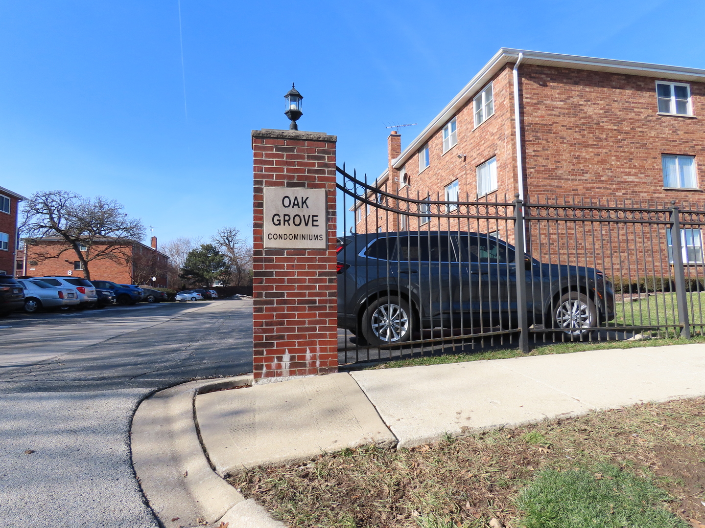 14830 Ketelaar Drive, Unit 4E Midlothian, IL 60445 - Photo 3 of 23 a view of a brick building and a street view