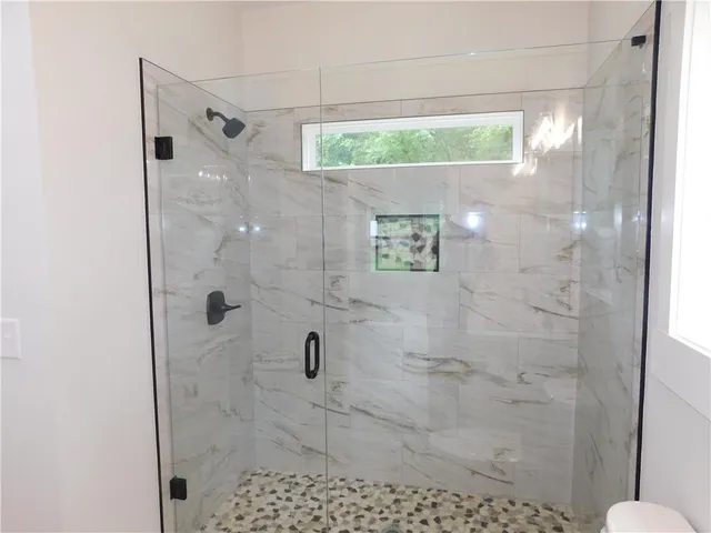 a bathroom with a sink toilet and mirror