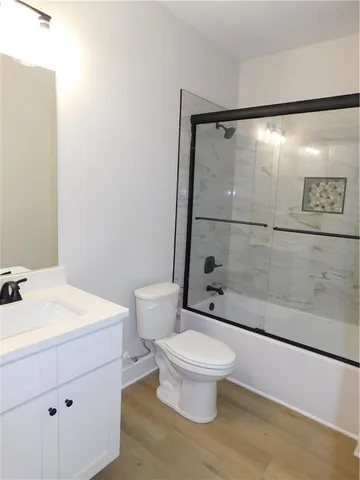 a bathroom with a shower and a toilet