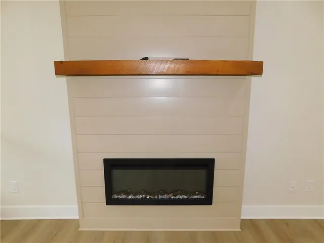 a kitchen with a sink a stove a refrigerator a center island and a window