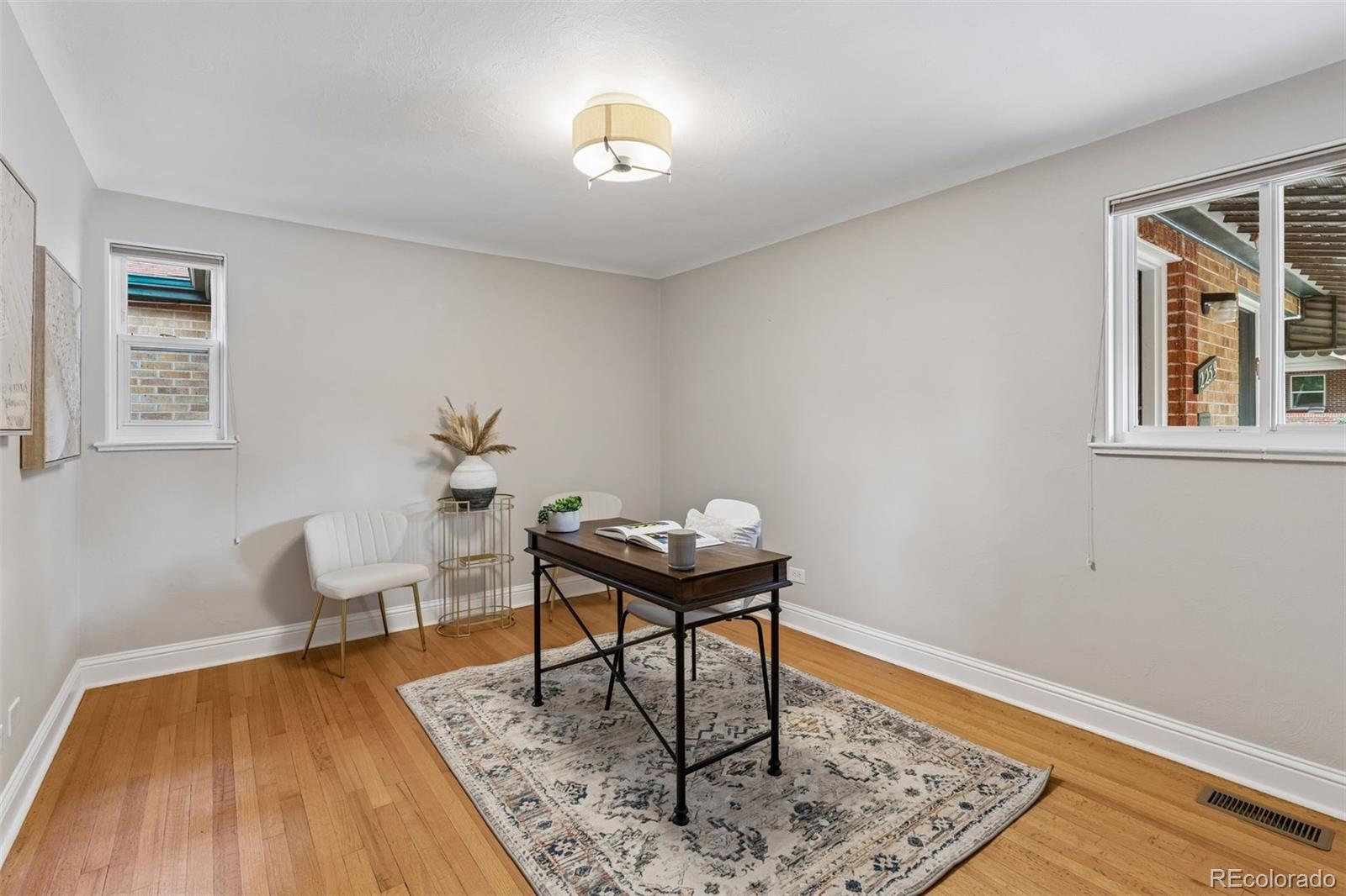 2255 Meade Street Denver, CO 80211 - Photo 19 of 30 a living room with furniture and wooden floor