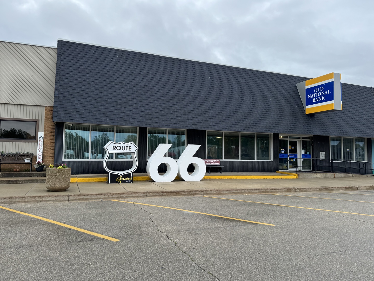 504 North Pine Street Gardner, IL 60424 - Photo 5 of 6 a view of a swimming pool with a lounge chairs in front of building