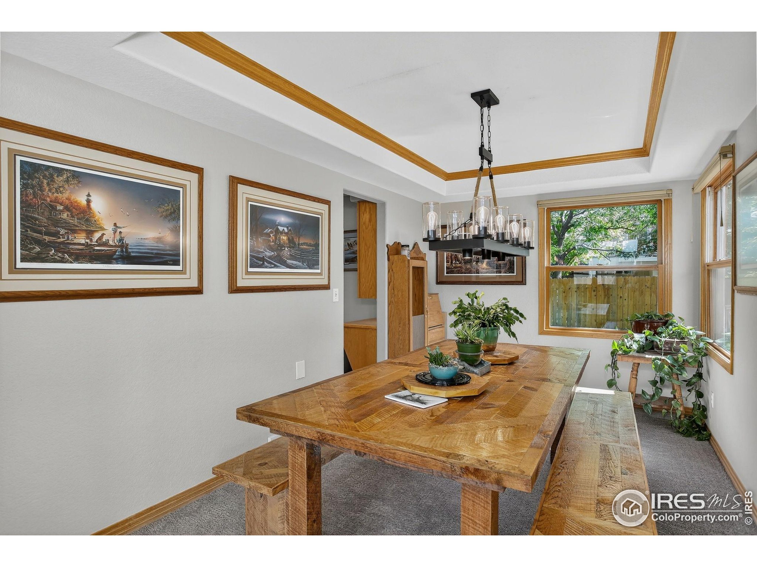 1840 Red Cloud Road Longmont, CO 80504 - Photo 12 of 42 a view of a dining room with furniture window and wooden floor