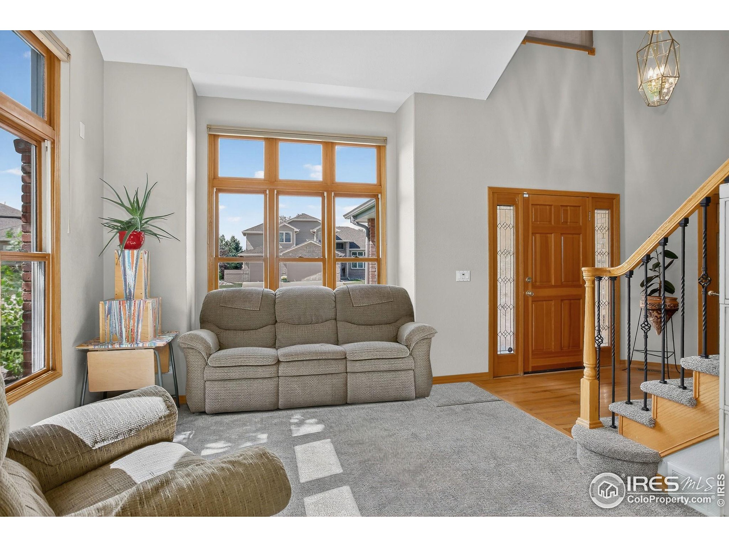 1840 Red Cloud Road Longmont, CO 80504 - Photo 14 of 42 a living room with furniture and a large window