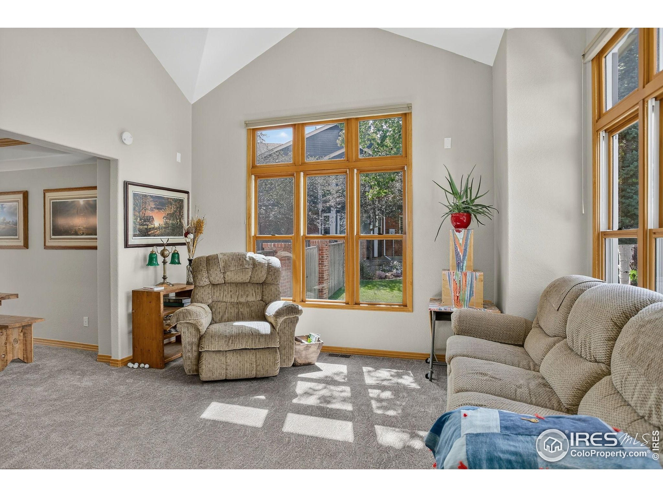 1840 Red Cloud Road Longmont, CO 80504 - Photo 15 of 42 a living room with furniture and a large window