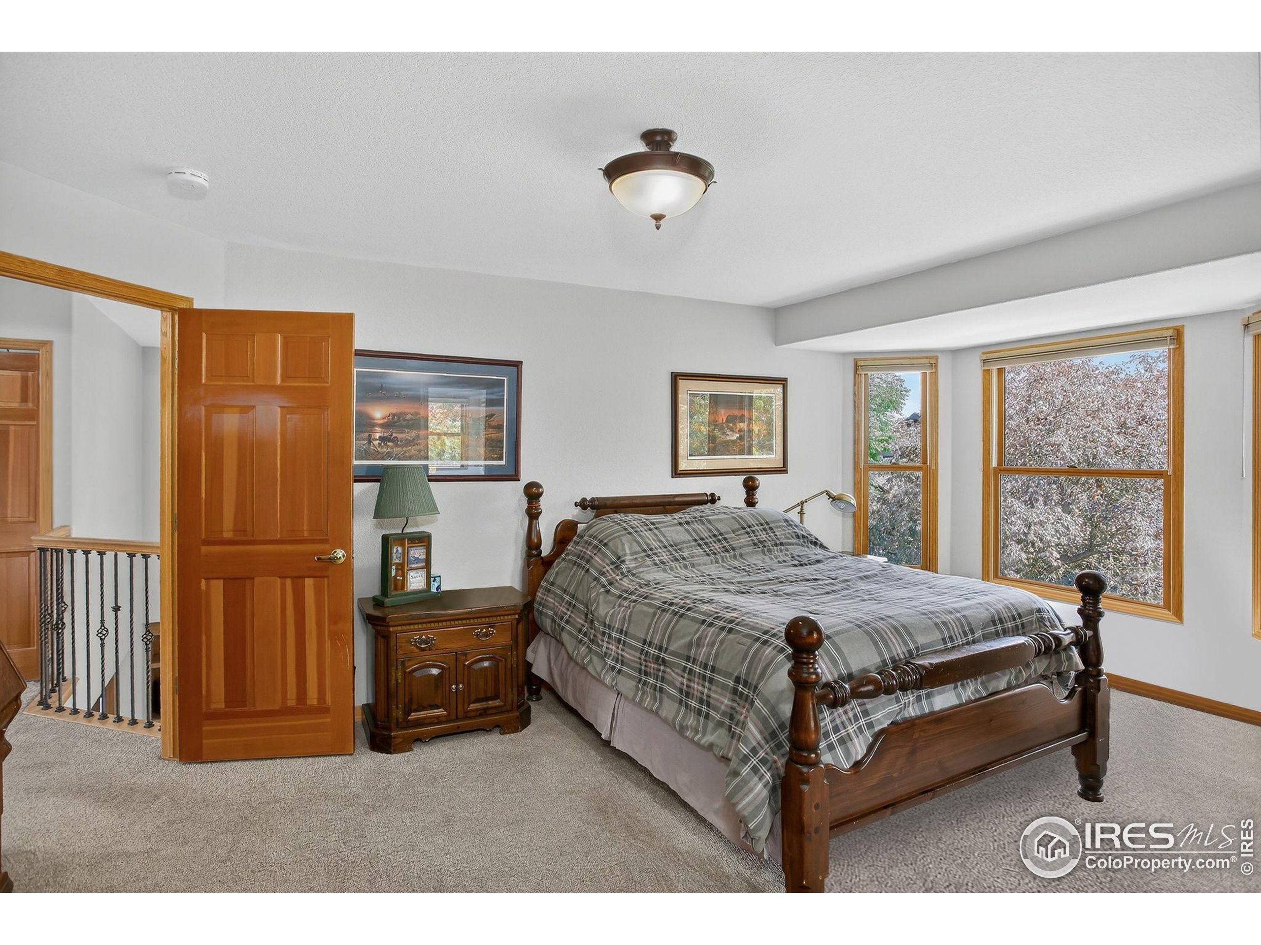 1840 Red Cloud Road Longmont, CO 80504 - Photo 16 of 42 a bed room with a bed and a window