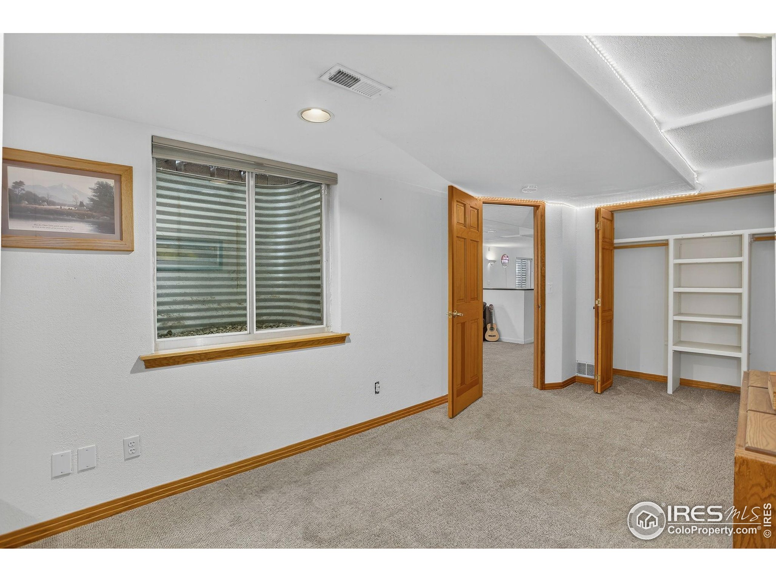 1840 Red Cloud Road Longmont, CO 80504 - Photo 20 of 42 a view of an empty room with closet and a window