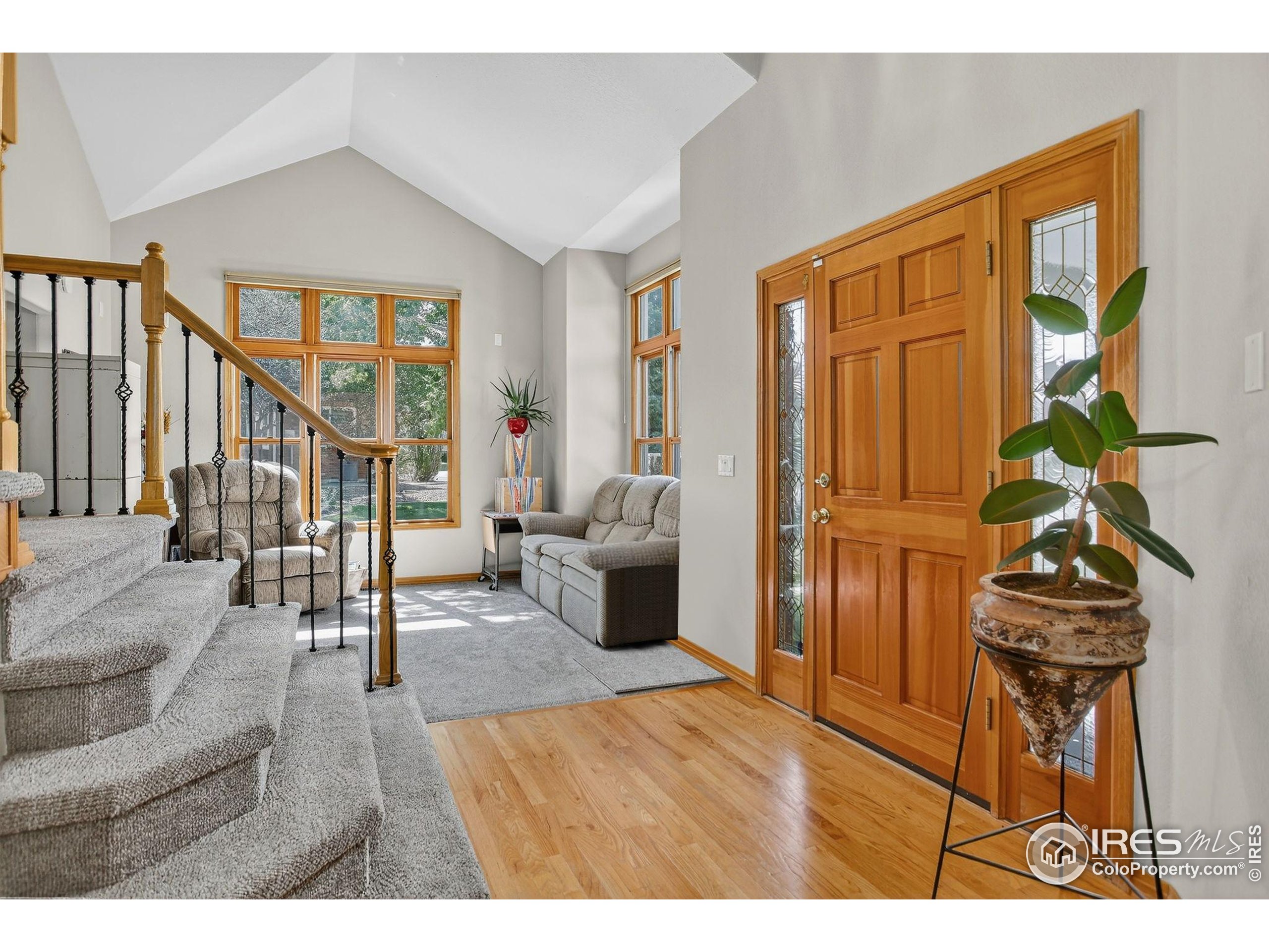 1840 Red Cloud Road Longmont, CO 80504 - Photo 2 of 42 a living room with furniture and a wooden floor