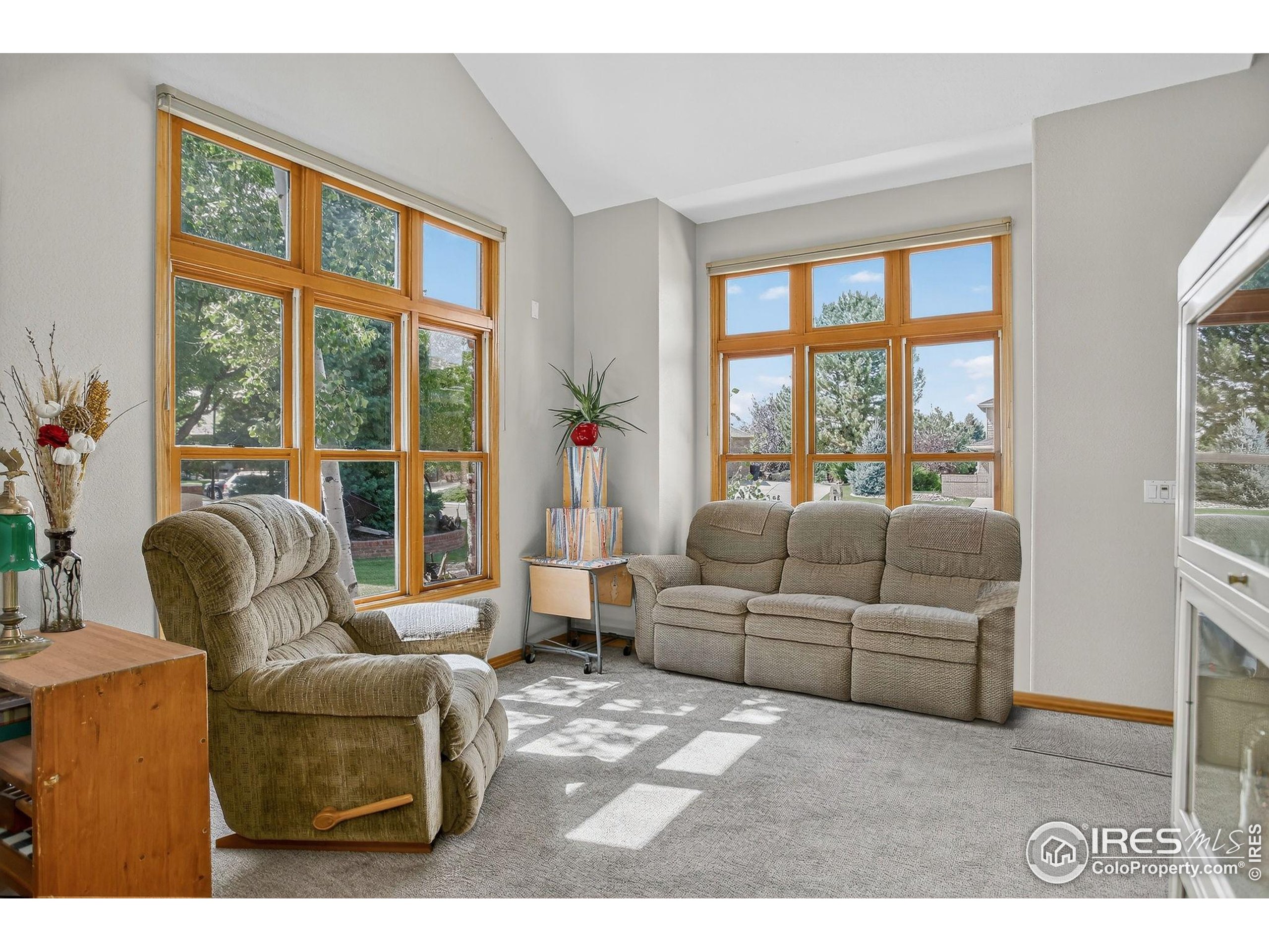 1840 Red Cloud Road Longmont, CO 80504 - Photo 23 of 42 a living room with furniture and a large window