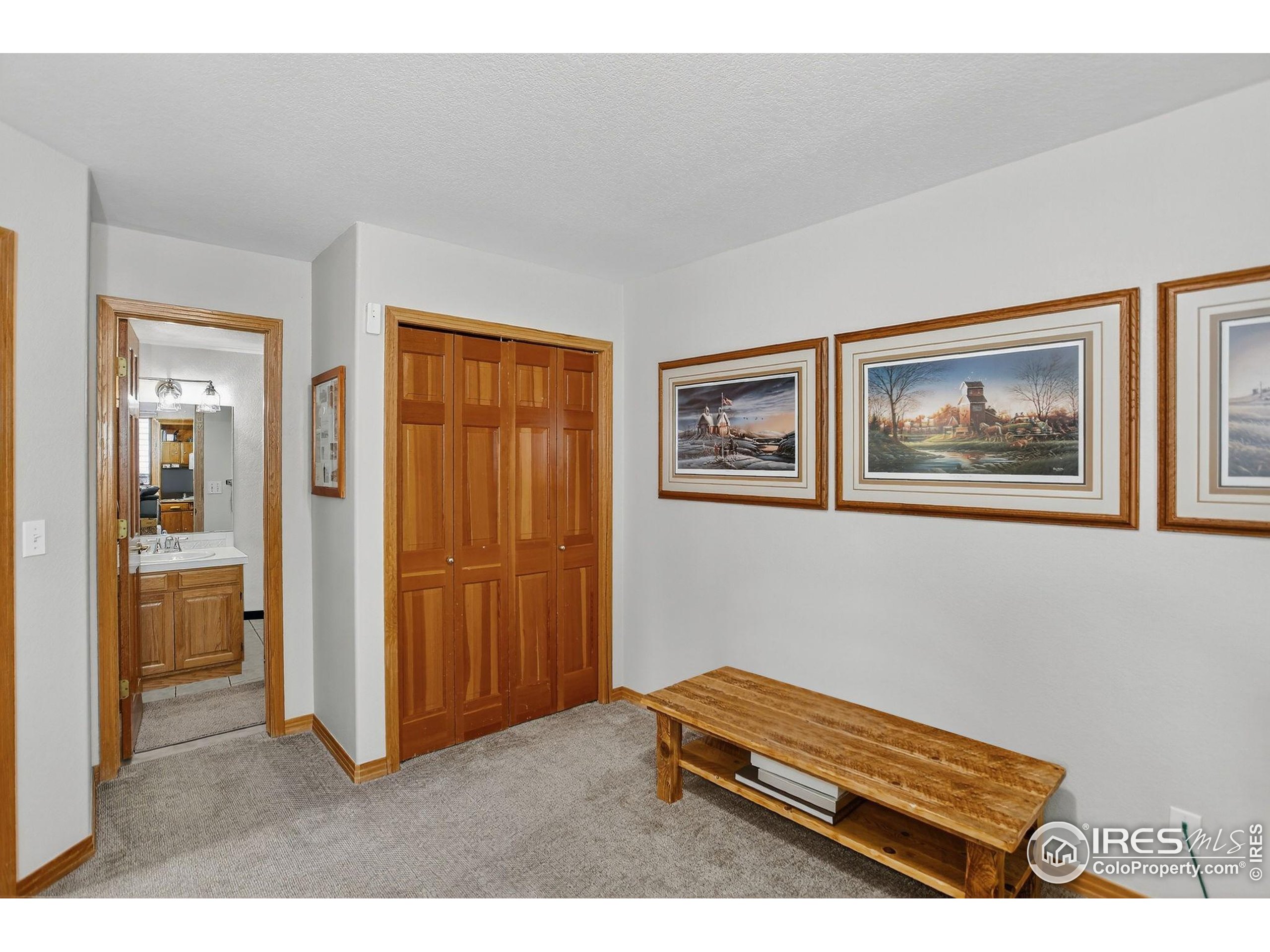 1840 Red Cloud Road Longmont, CO 80504 - Photo 25 of 42 a living room with furniture and a window