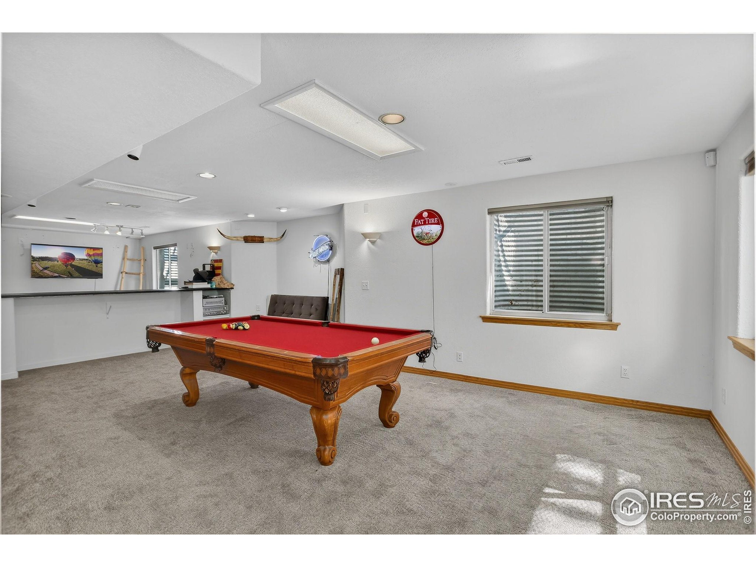 1840 Red Cloud Road Longmont, CO 80504 - Photo 27 of 42 a room with furniture pool table and windows