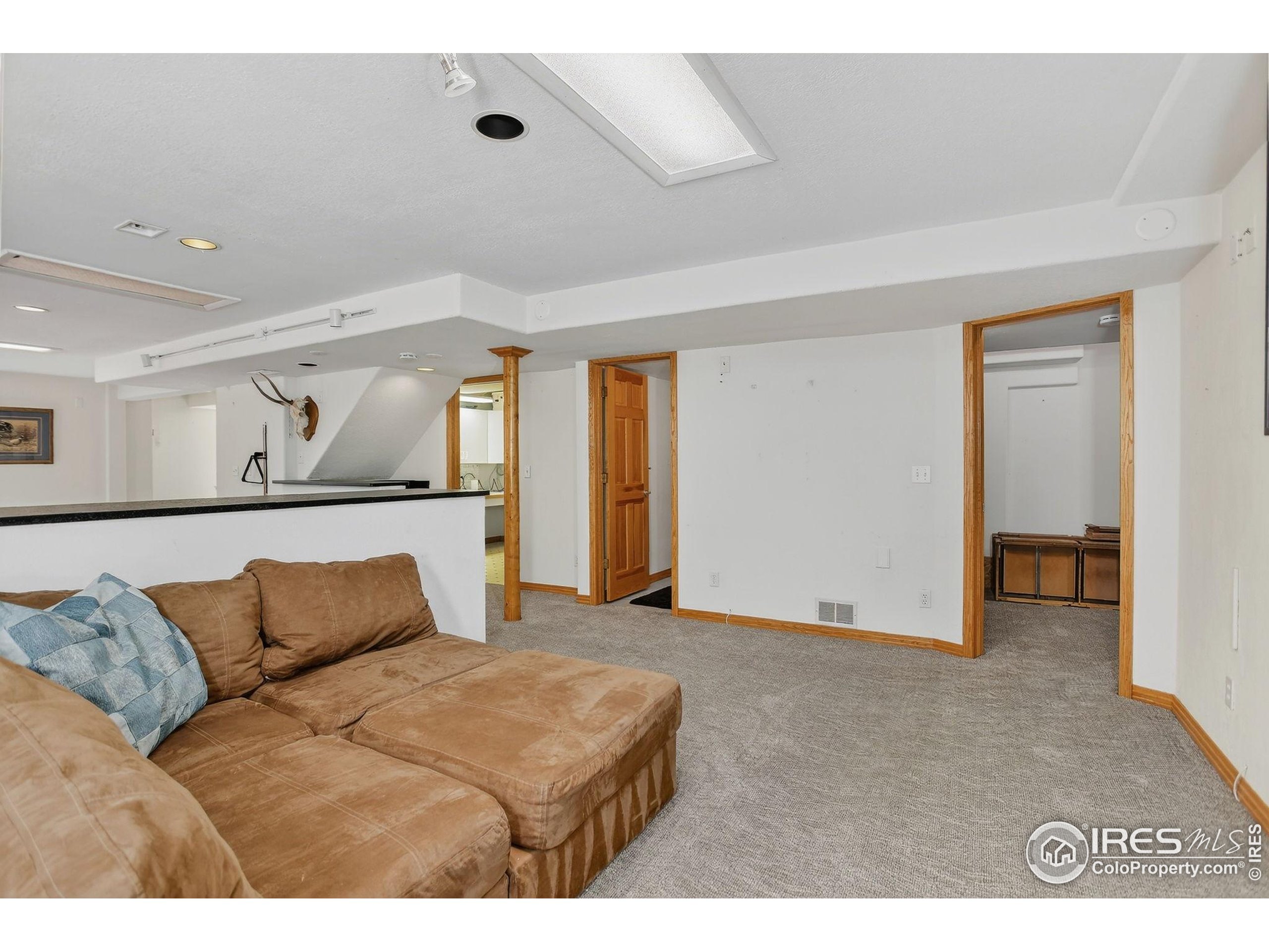1840 Red Cloud Road Longmont, CO 80504 - Photo 29 of 42 a living room with furniture and a couch