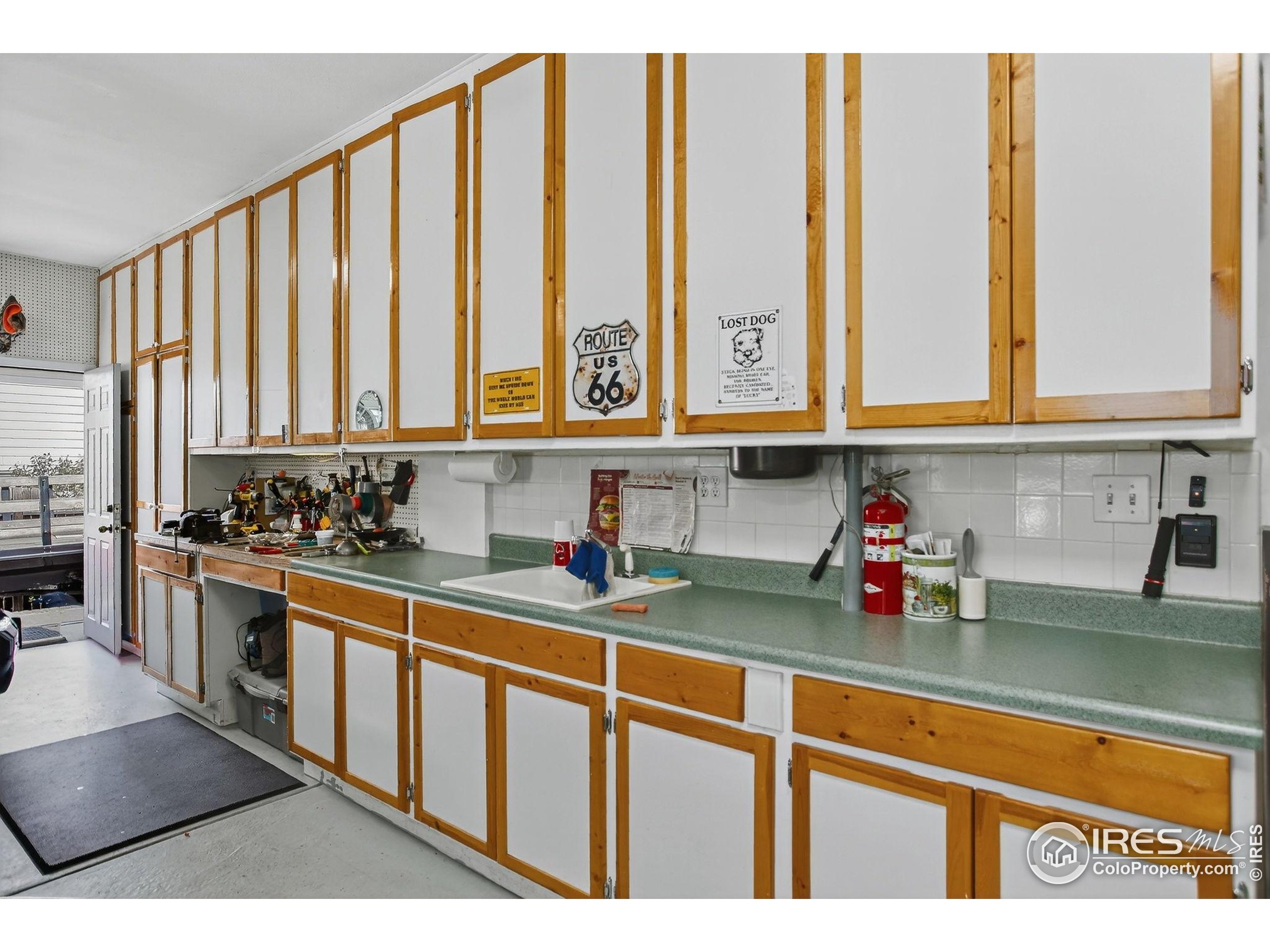 1840 Red Cloud Road Longmont, CO 80504 - Photo 32 of 42 a kitchen with stainless steel appliances granite countertop a sink a stove and cabinets