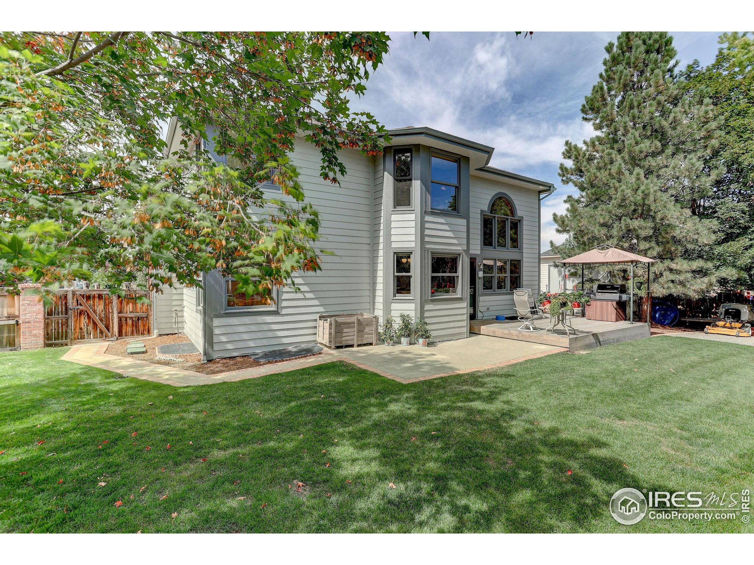 1840 Red Cloud Road Longmont, CO 80504 - Photo 34 of 42 a view of a house with a yard porch and sitting area