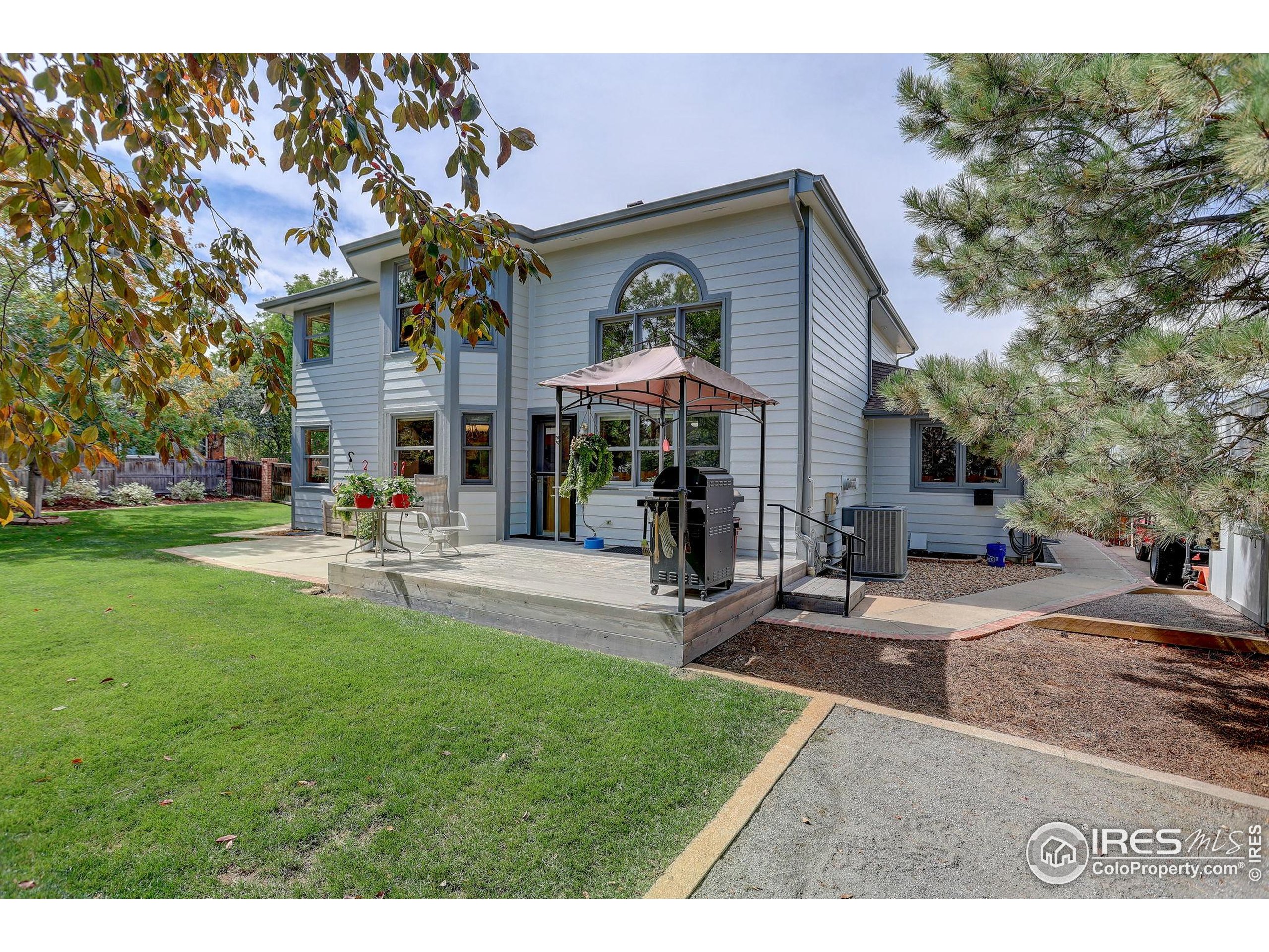 1840 Red Cloud Road Longmont, CO 80504 - Photo 35 of 42 a view of a building with a garden and sitting area
