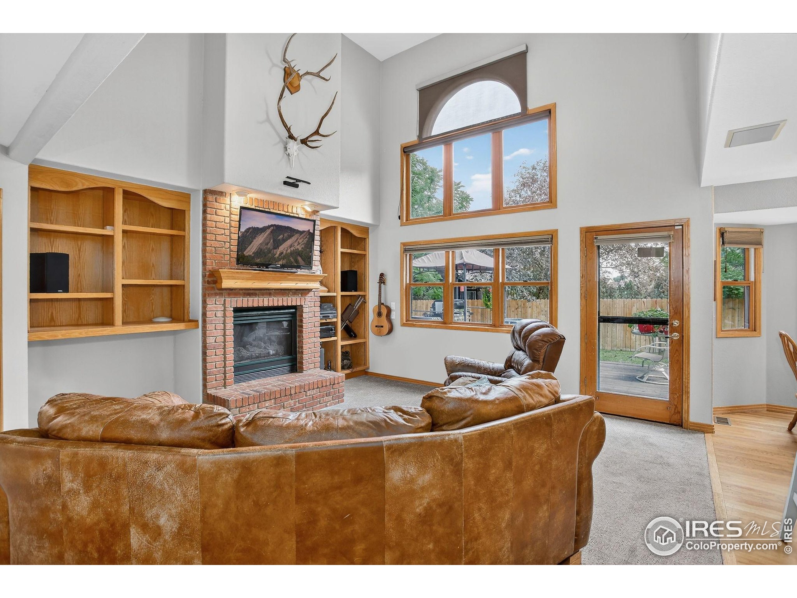 1840 Red Cloud Road Longmont, CO 80504 - Photo 5 of 42 a living room with fireplace furniture and a window